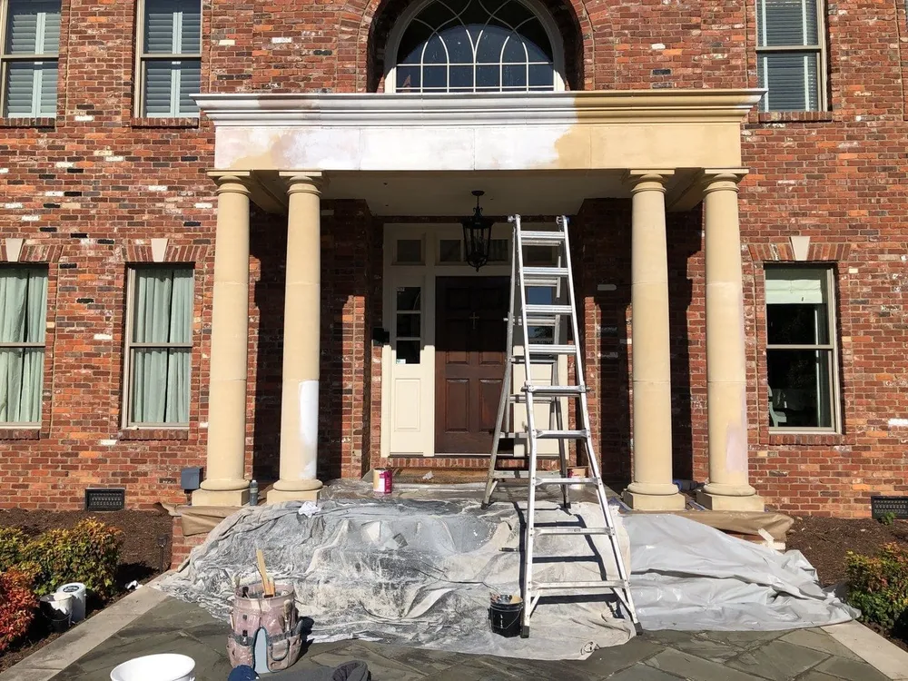 Painters repainting a home exterior in Nashville, TN